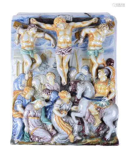 An Italian maiolica wall tile moulded in relief with The Cru...