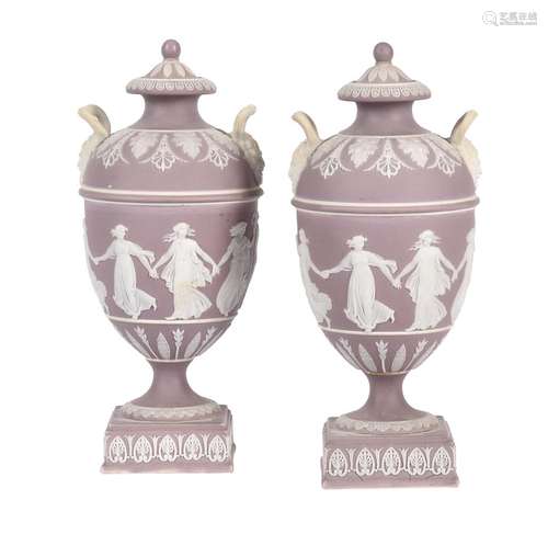 A pair of Wedgwood lilac-dip Jasper two handled urns and cov...