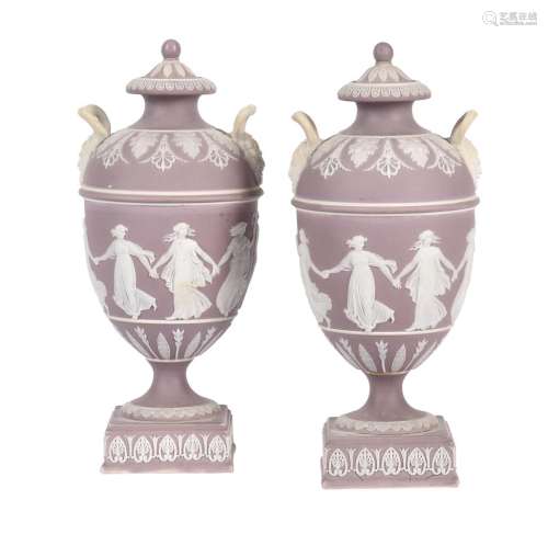 A pair of Wedgwood lilac-dip Jasper two handled urns and cov...