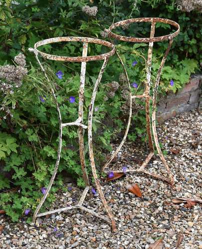 A pair of white painted cast iron jardinière or torchere sta...