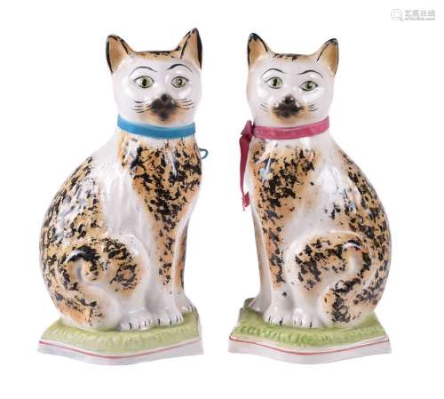 A pair of Staffordshire pottery models of cats of William Ke...