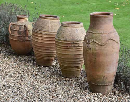 A pair of terracotta baluster garden vases