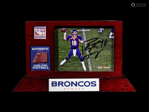 A Peyton Manning Signed Photograph and Game Used