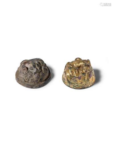 A gilt-bronze 'tiger' mat weight and a bronze 'tiger and bea...