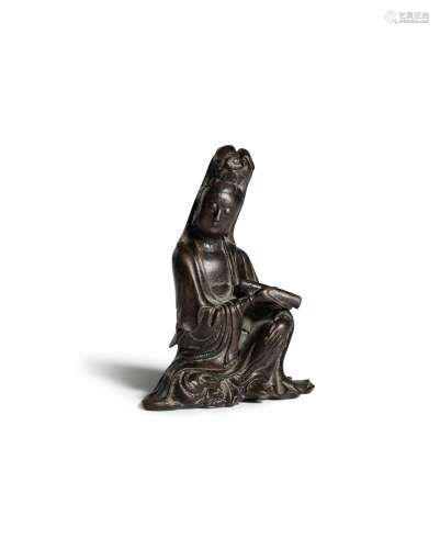 A bronze figure of a seated Guanyin
