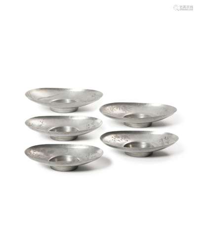 A set of five inscribed pewter saucer dishes