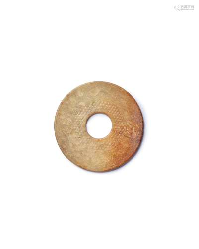 A brown and russet 'archaistic' jade disc, bi