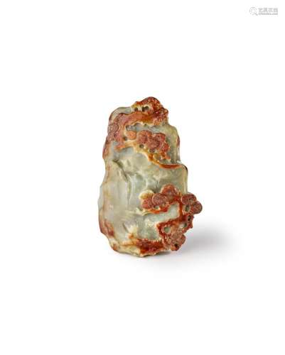 A grey and russet jade 'pine tree' paper weight