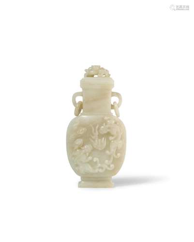 A pale green jade carved 'chilong' vase and cover
