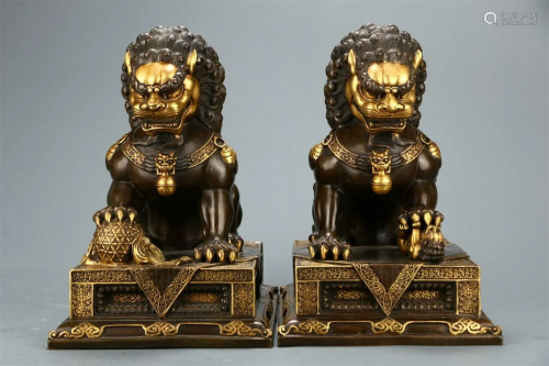 A Pair of Gilt Copper Bodied Lion Ornaments
