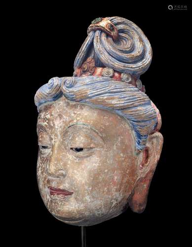 A MASSIVE POLYCHROME PAINTED STUCCO HEAD OF GUANYIN