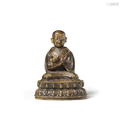 A COPPER-ALLOY COPPER-INLAID FIGURE OF A SAKYA LAMA