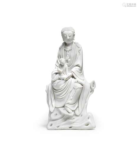 A BLANC DE CHINE FIGURE OF GUANYIN AND CHILD