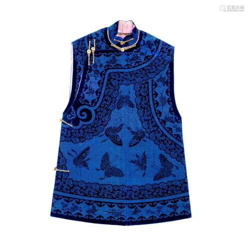 A MANCHU WOMAN'S DARK BLUE VELVET 'BUTTERFLIES' INFORMAL VES...