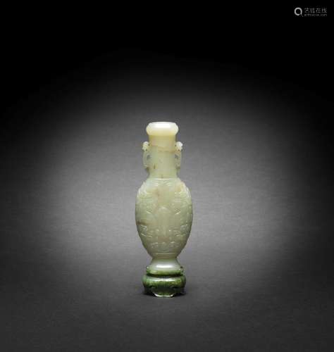 AN ARCHAISTIC PALE GREEN JADE VASE, HU