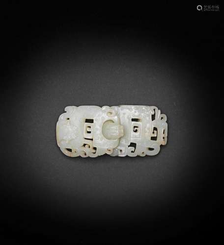 A very pale green jade archaistic belt buckle