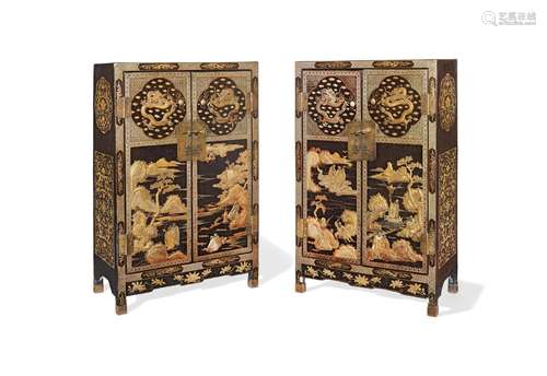 A pair of gilt-decorated black lacquer cabinets