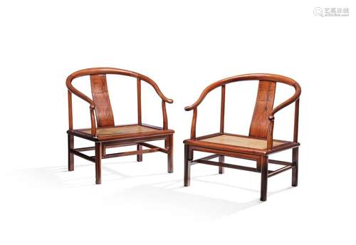 A PAIR OF HUANGHUALI HORSESHOE-BACK LOW ARMCHAIRS