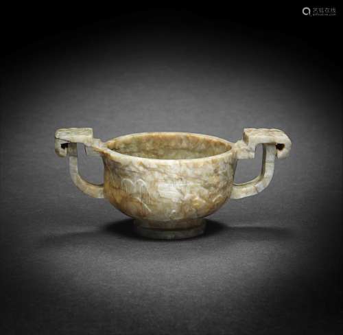 A 'CHICKEN BONE' JADE TWO-HANDLED CUP