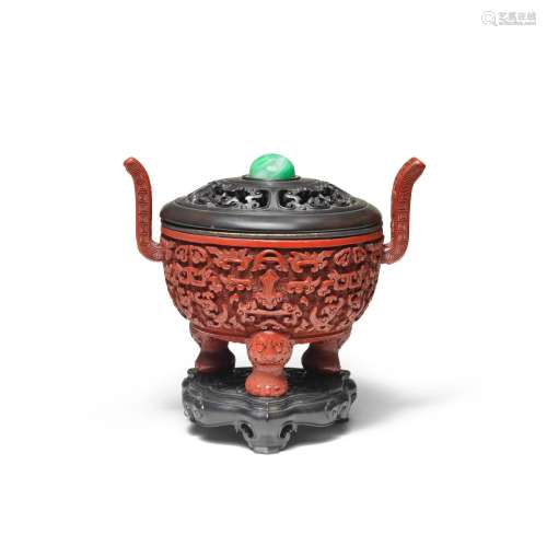 A RARE CINNABAR LACQUER CARVED TRIPOD INCENSE BURNER, DING
