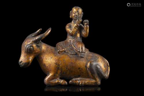A gilt bronze figure of a ox ridden by a child (defects) Chi...
