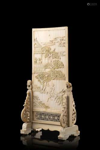 An ivory table screen, carved with figures and pagodas on th...