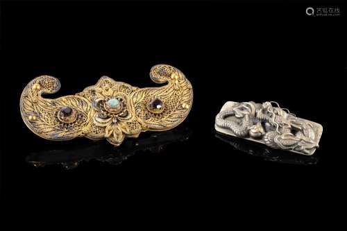 Two decorations for hats, one in gilt metal filigrane shaped...