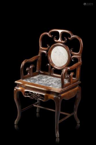 A red wood (probably hongmu) armchair, seat and back with ma...