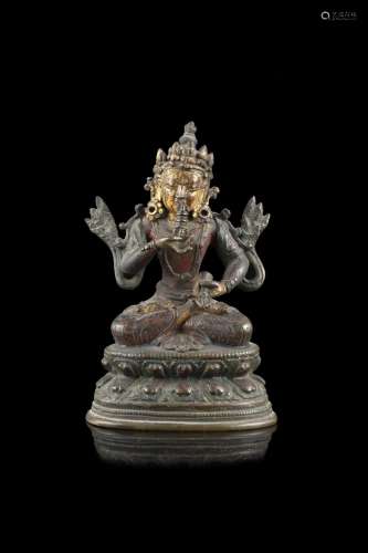 A bronze seated Buddha, with traces of gilding and pigments,...