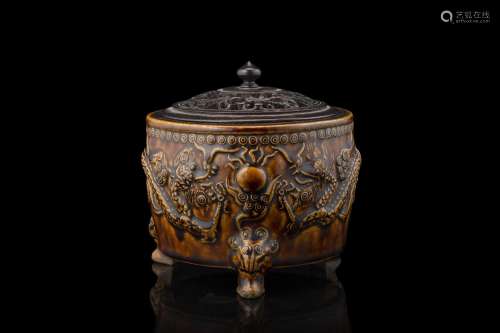 A brown glazed tripod censer, dragons relief, carved wood co...