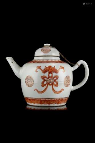 A porcelain tea pot with rust red decoration of bats and bud...