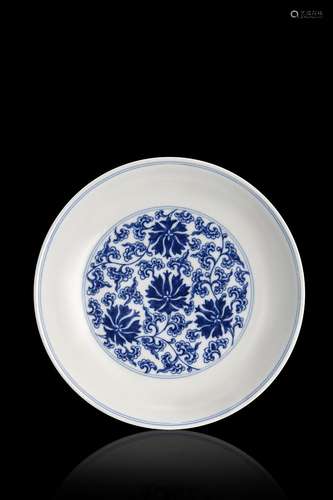 A blue and white porcelain plate, apocryphal Qianlong mark C...