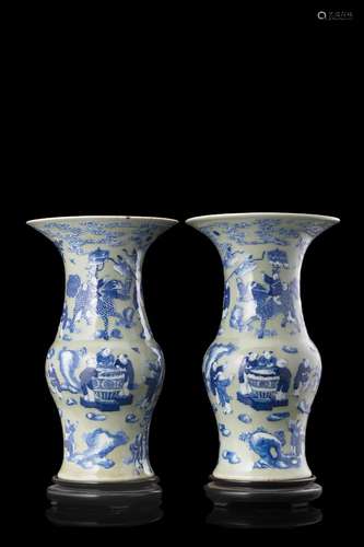 A pair of "one hundred boys" celadon ground vases,...