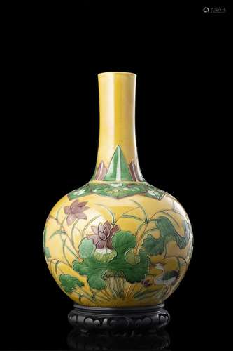 A sancai glaze bottle vase, decorated with flowers and crane...