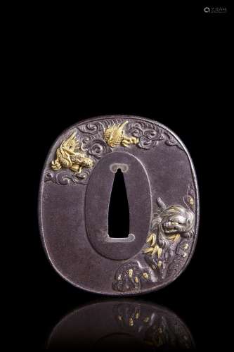 Oval iron tsuba for wakizashi, decorated with dragon and tig...