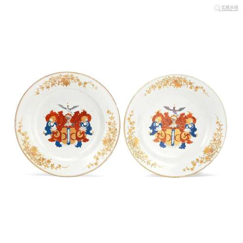 A PAIR OF FAMILLE ROSE 'DUTCH MARKET' ARMORIAL DISHES