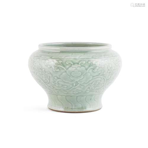 A CARVED CELADON-GLAZED 'LOTUS' JAR