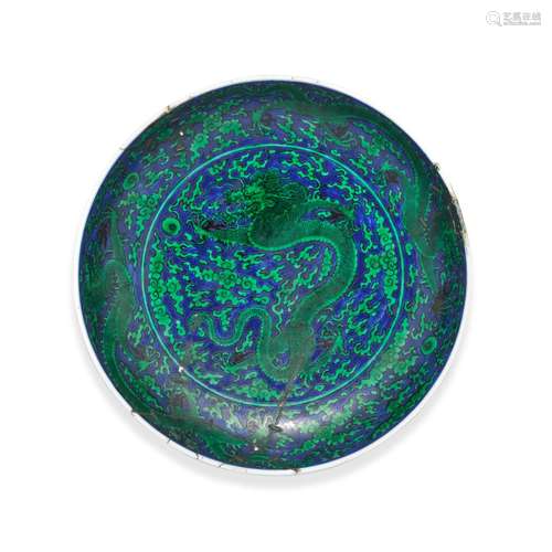 A FINE BLUE-GROUND GREEN-ENAMELLED 'DRAGON' DISH