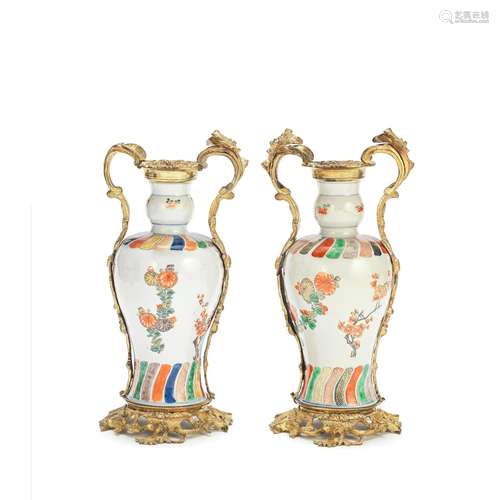 A PAIR OF UNUSUAL UNDERGLAZE BLUE AND ENAMELLED VASES WITH G...