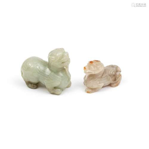 A WHITE AND RUSSET AND A PALE GREEN JADE CARVING OF BIXIE