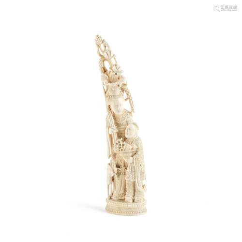 AN IVORY TUSK CARVING OF A LADY AND BOY