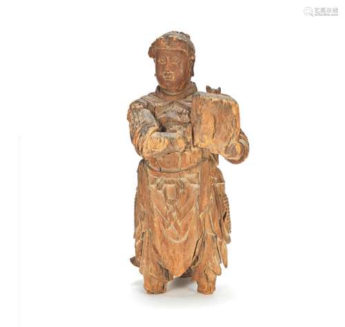 A CARVED WOOD FIGURE OF AN ATTENDANT