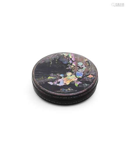 A MOTHER-OF-PEARL INLAID BLACK LACQUER CIRCULAR BOX AND COVE...