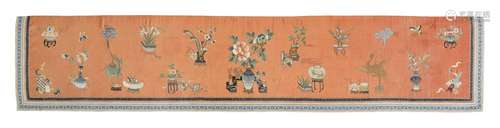 AN APRICOT-GROUND SILK-EMBROIDERED 'HUNDRED ANTIQUES' TEXTIL...