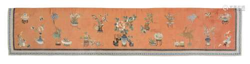 AN APRICOT-GROUND SILK-EMBROIDERED 'HUNDRED ANTIQUES' TEXTIL...