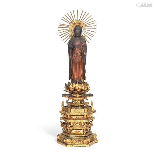 A CARVED AND GILDED WOOD STANDING FIGURE OF AMIDA BUDDHA