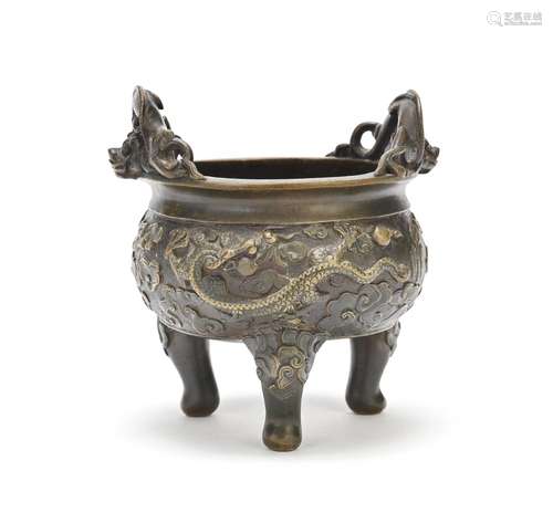 A BRONZE TRIPOD CENSER WITH 'DRAGON' HANDLES