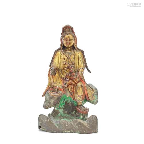 A GILT AND LACQUERED BRONZE FIGURE OF GUANYIN