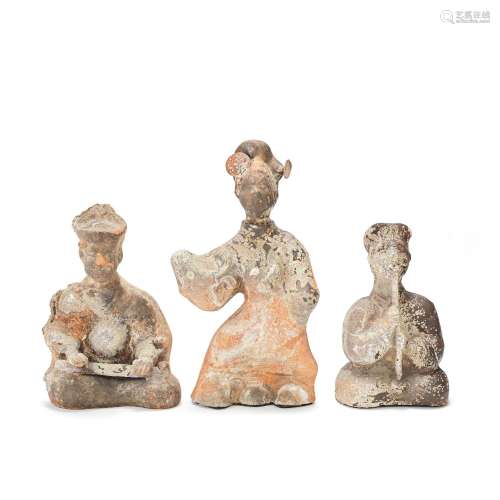 A GROUP OF THREE POTTERY MODELS OF MUSICIANS AND A DANCER