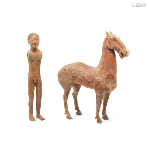 A LARGE POTTERY MODEL OF A HORSE AND A STICK FIGURE